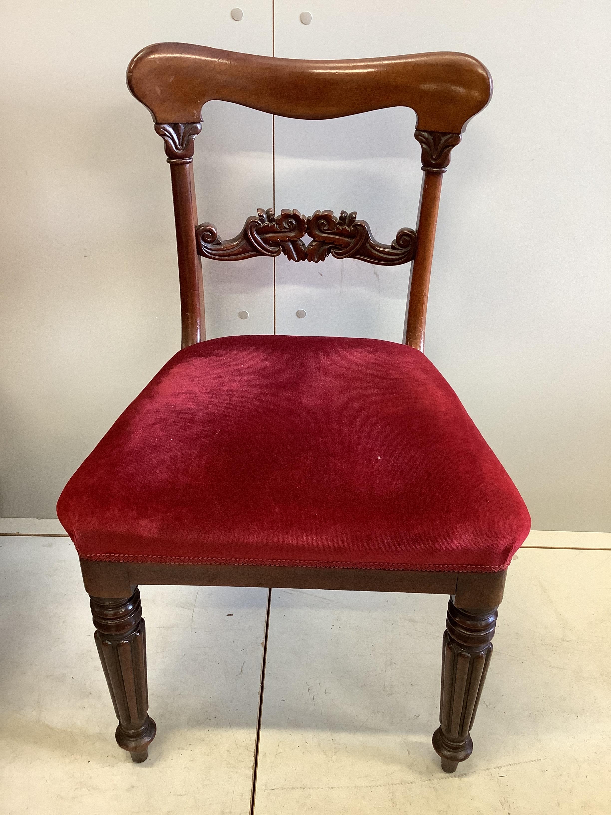 A set of eight early Victorian mahogany dining chairs, on turned fluted legs